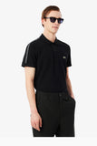 Polo Lacoste nera con banda logata