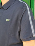 Polo Lacoste blu navy con banda logata