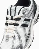 Scarpe NEW BALANCE 1906 bianco nero  e argento