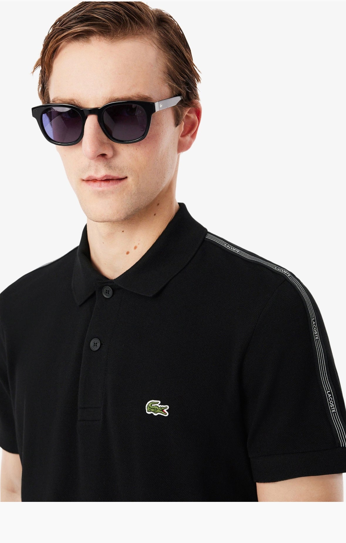 Polo Lacoste nera con banda logata