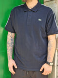 Polo Lacoste blu navy con banda logata
