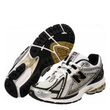 Scarpe NEW BALANCE 1906 bianco nero e oro